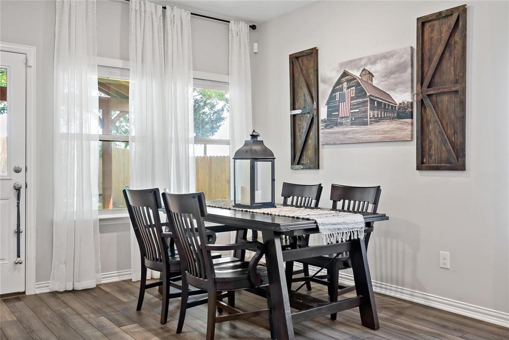2003 Atlantic Avenue Anna, TX 75409 - Photo 2 of 22 a view of a dining room with furniture window and wooden floor