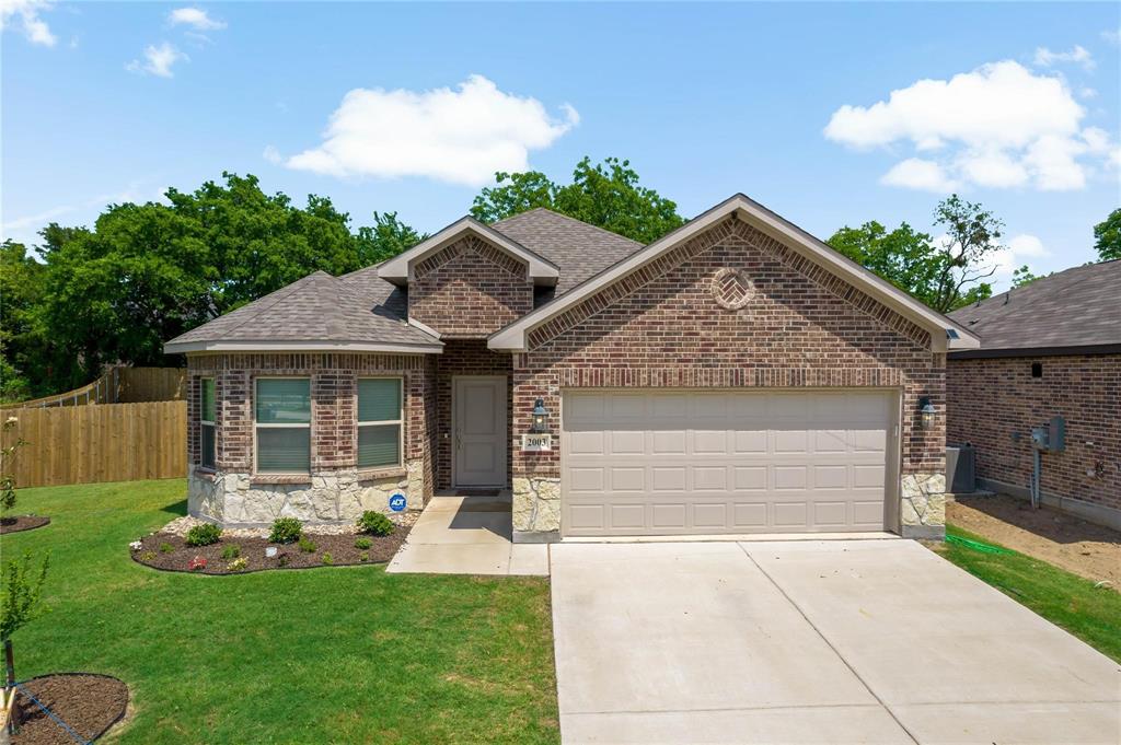 2003 Atlantic Avenue Anna, TX 75409 - Photo 4 of 22 a front view of house with yard and outdoor seating