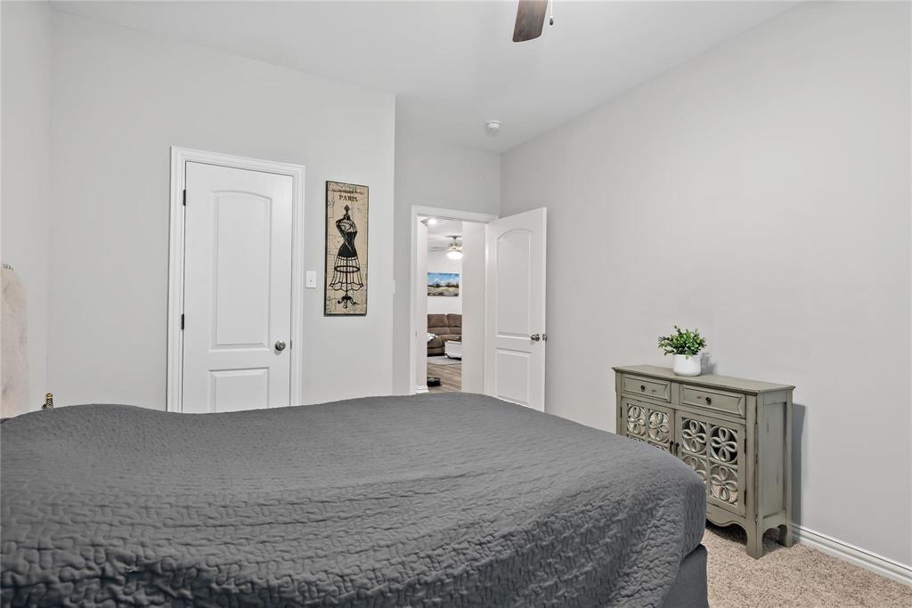 2003 Atlantic Avenue Anna, TX 75409 - Photo 8 of 22 a bedroom with a bed and a window