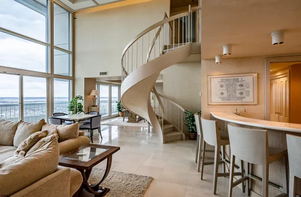 a living room with furniture and a table