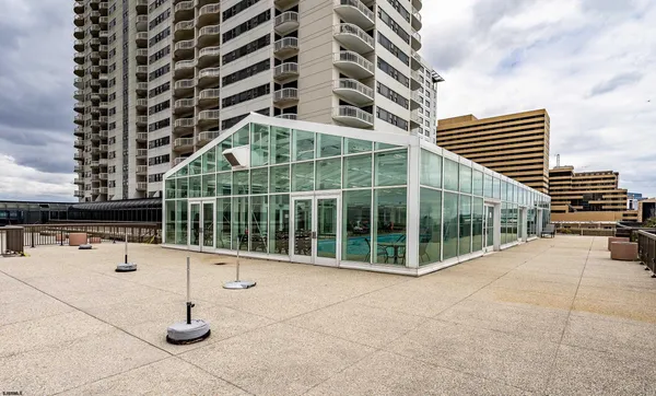 a view of a balcony with potted plants