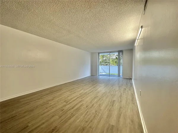 a view of an empty room and window