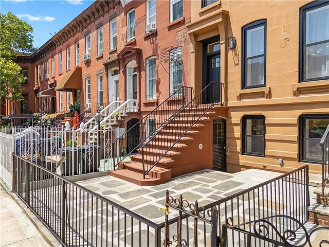 a view of a brick building with many windows