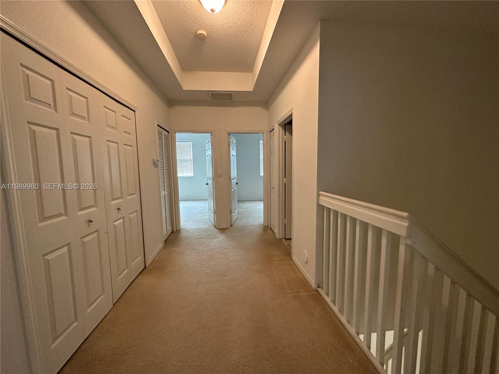 16602 Southwest 78th Terrace Miami, FL 33193 - Photo 11 of 18 a view of a hallway with wooden floor and entryway