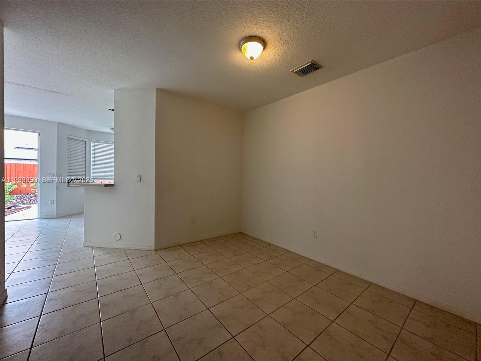 16602 Southwest 78th Terrace Miami, FL 33193 - Photo 15 of 18 wooden floor in an empty room