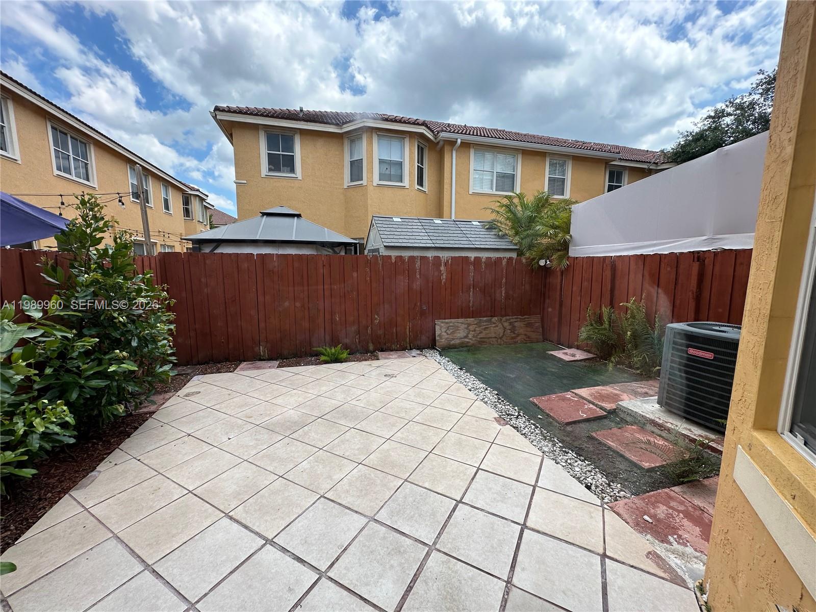 16602 Southwest 78th Terrace Miami, FL 33193 - Photo 18 of 18 a front view of a house with garden