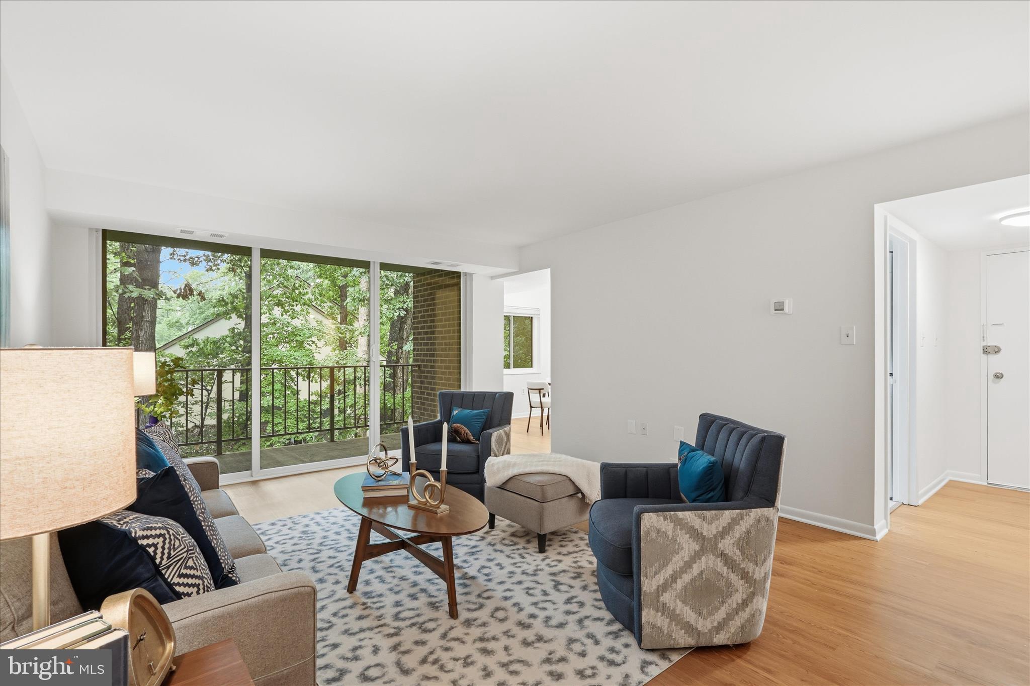 1540 Northgate Square, Unit 21B Reston, VA 20190 - Photo 2 of 24 a living room with furniture and a large window