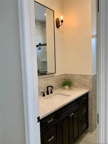 a bathroom with a sink and a mirror