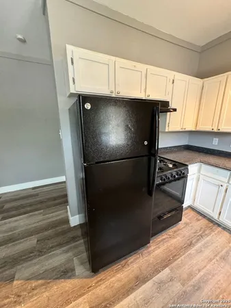 a stove top oven sitting inside of a kitchen