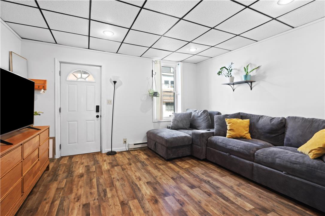 431 Pierce Street Bethlehem, PA 18015 - Photo 5 of 27 Warm wood-look flooring sets a welcoming tone in this naturally illuminated living space.