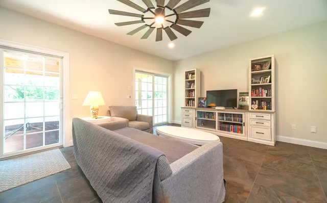 a living room with furniture and white walls