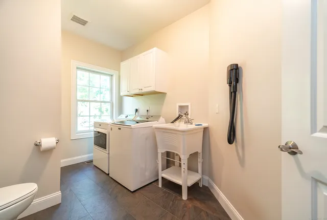 a utility room with dryer and washer