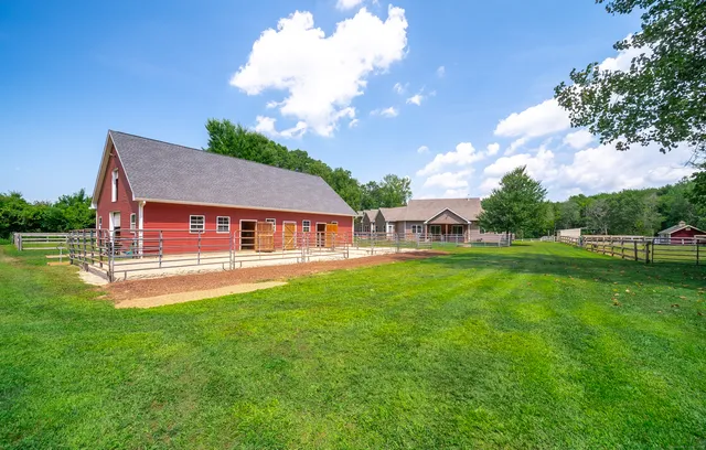 a view of a house with a big yard