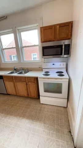 a kitchen with a stove and a microwave