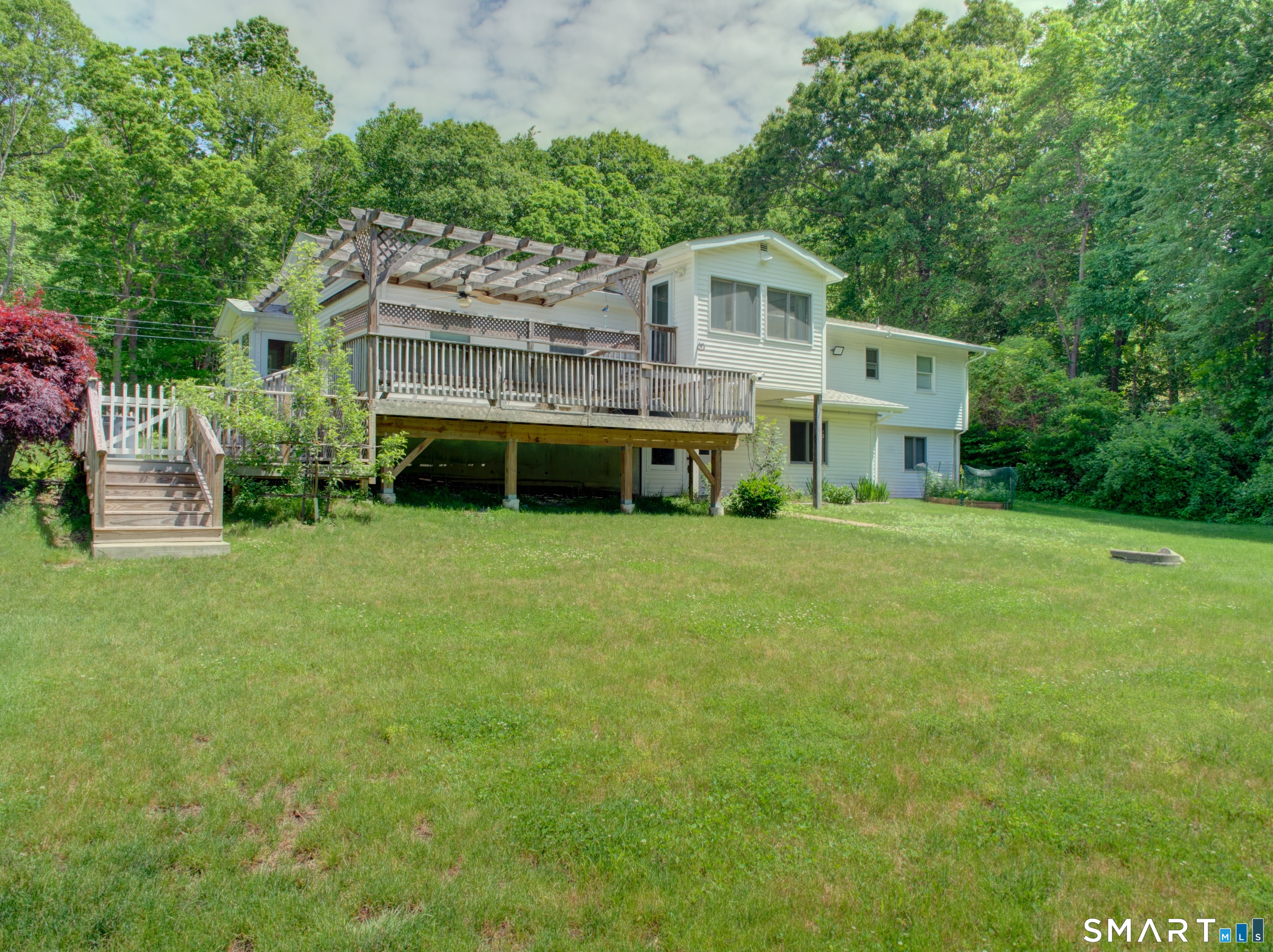 311 Sandy Hollow Road Groton, CT 06355 - Photo 22 of 26 a house view with a garden space