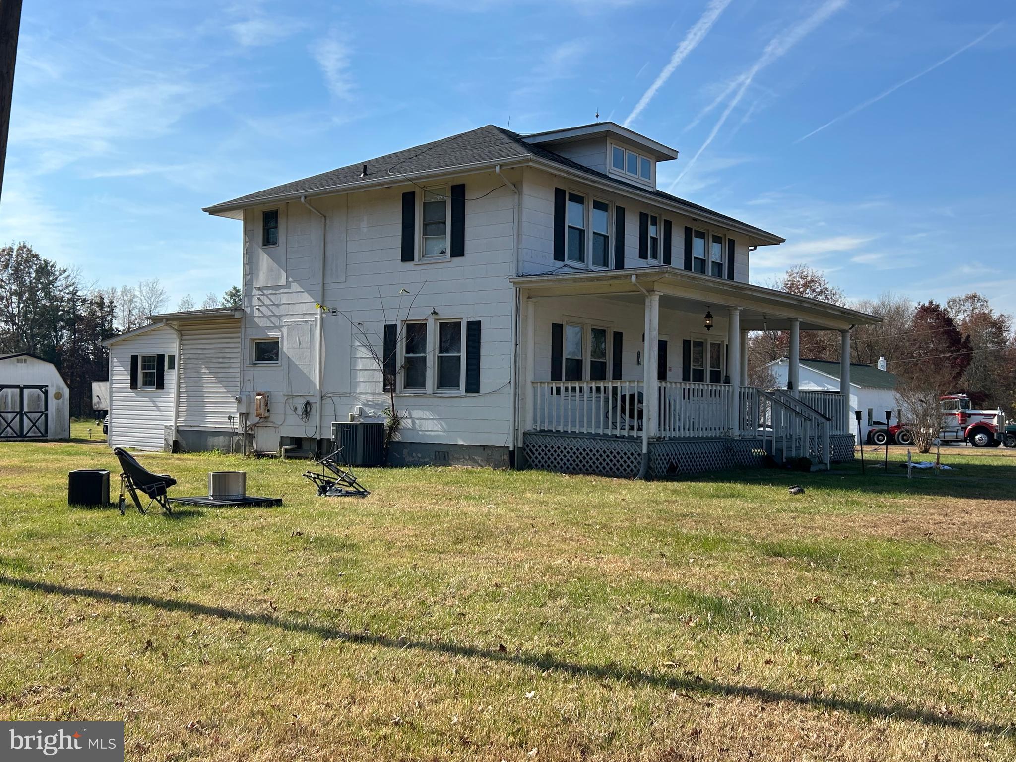 7183 Opal Road Warrenton, VA 20186 - Photo 2 of 11 a front view of a house with swimming pool