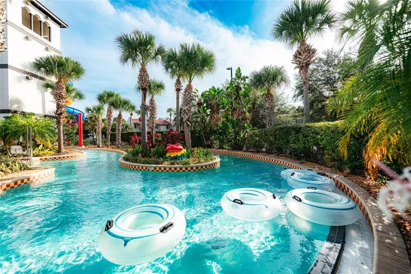 a view of a swimming pool with lounge chairs