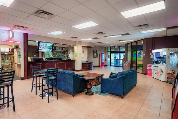 a view of a dinning table and chairs in the patio