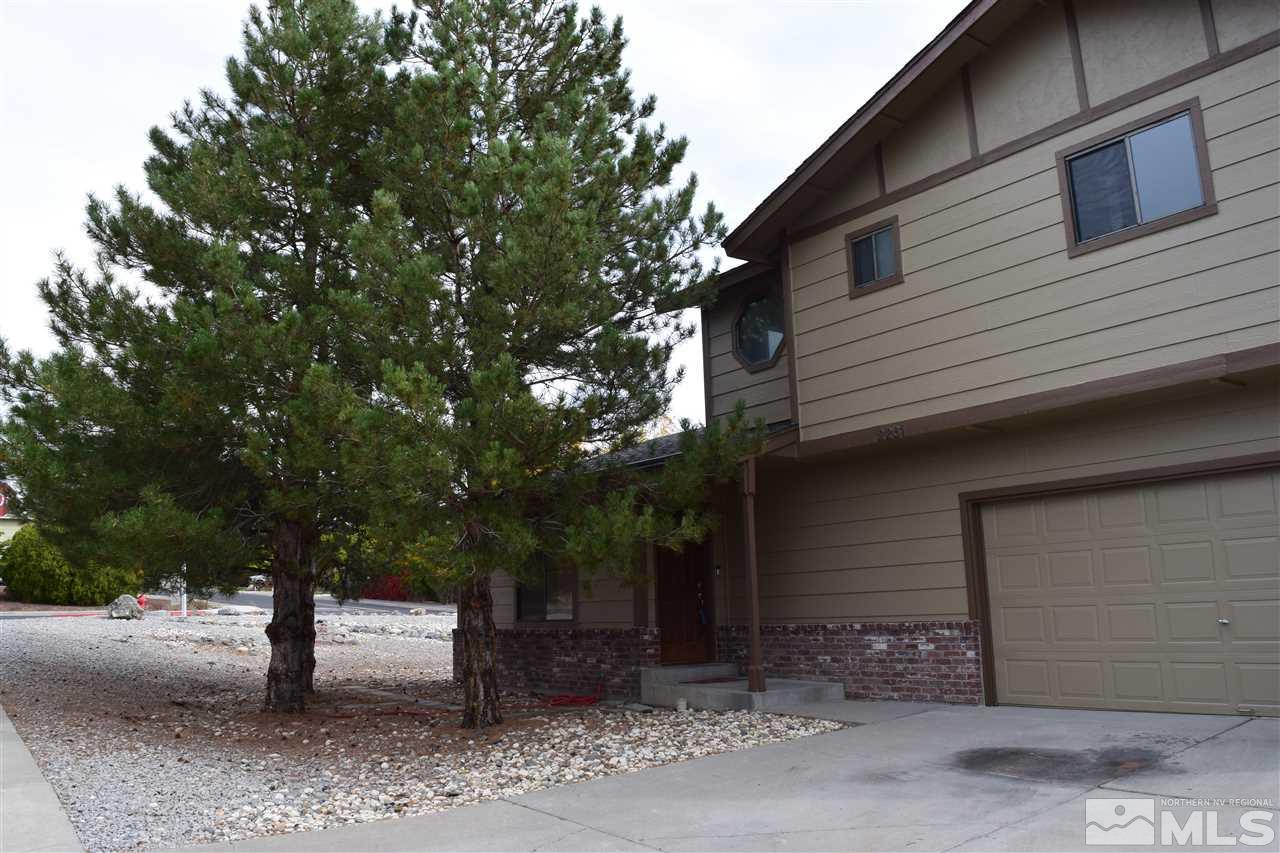 2261 Cobblestone Court Reno, NV 89503 - Photo 1 of 1 a front view of a house with a yard