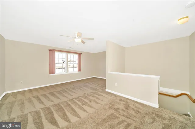 a view of a cars park in front of a building