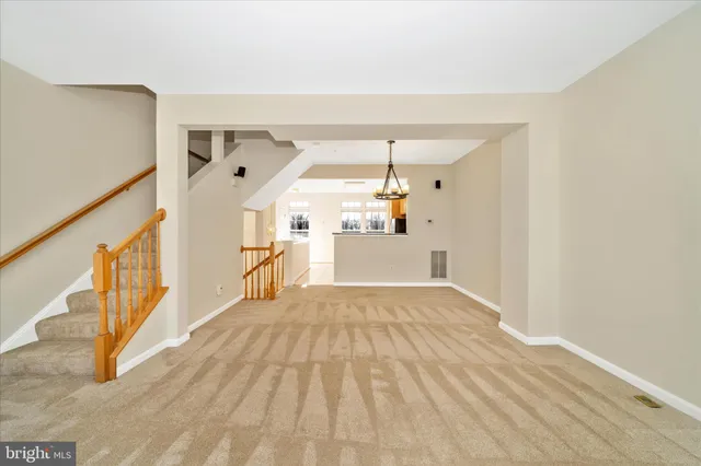 a kitchen with stainless steel appliances granite countertop a refrigerator stove top oven and sink