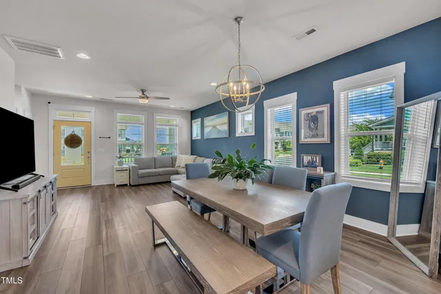 a kitchen with granite countertop a sink stainless steel appliances and cabinets