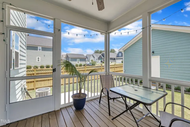 a front view of a house with a garden and porch