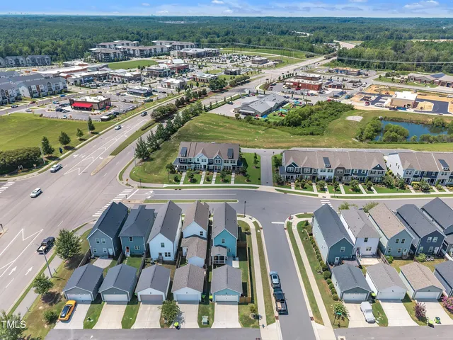 an aerial view of a house with a ocean view
