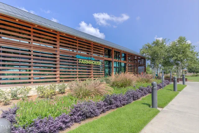 an aerial view of a house with an outdoor space and balcony