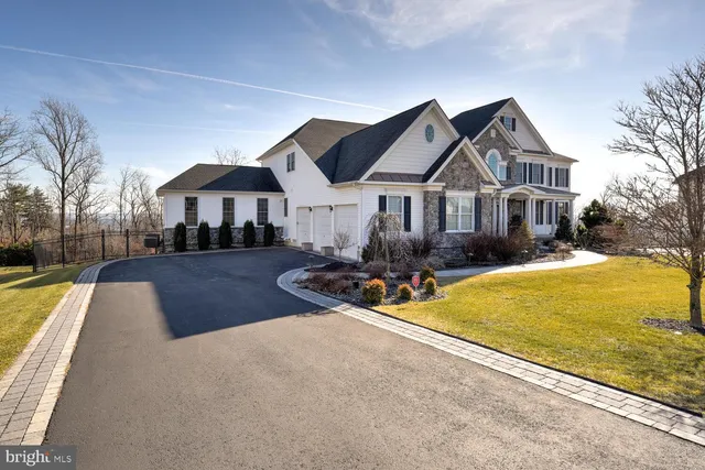 a view of living room with furniture and a fireplace