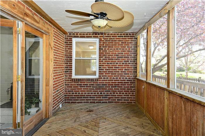 9903 Sidney Road Silver Spring, MD 20901 - Photo 22 of 26 a view of a brick house with a large window