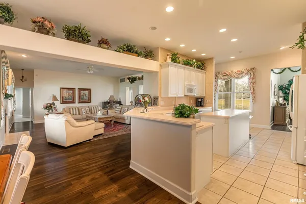 a kitchen with a sink cabinets and window