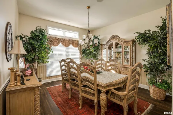 a bedroom with a bed and a table