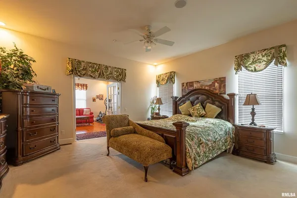 a view of a porch with a table and chairs