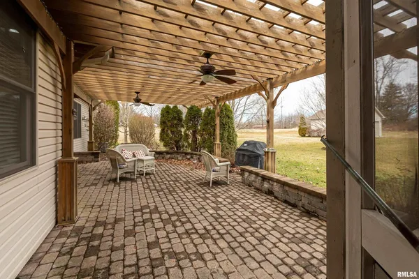 a view of a garden with an outdoor seating