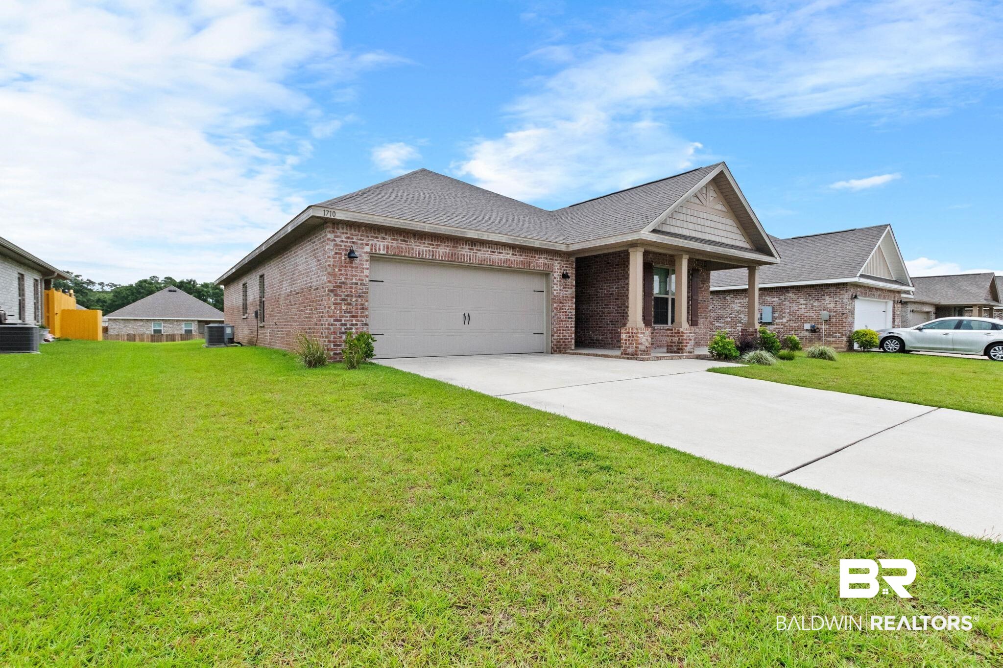 1710 Grouse Street Foley, AL 36535 - Photo 8 of 76 Brick exterior residence featuring an attached two-car garage