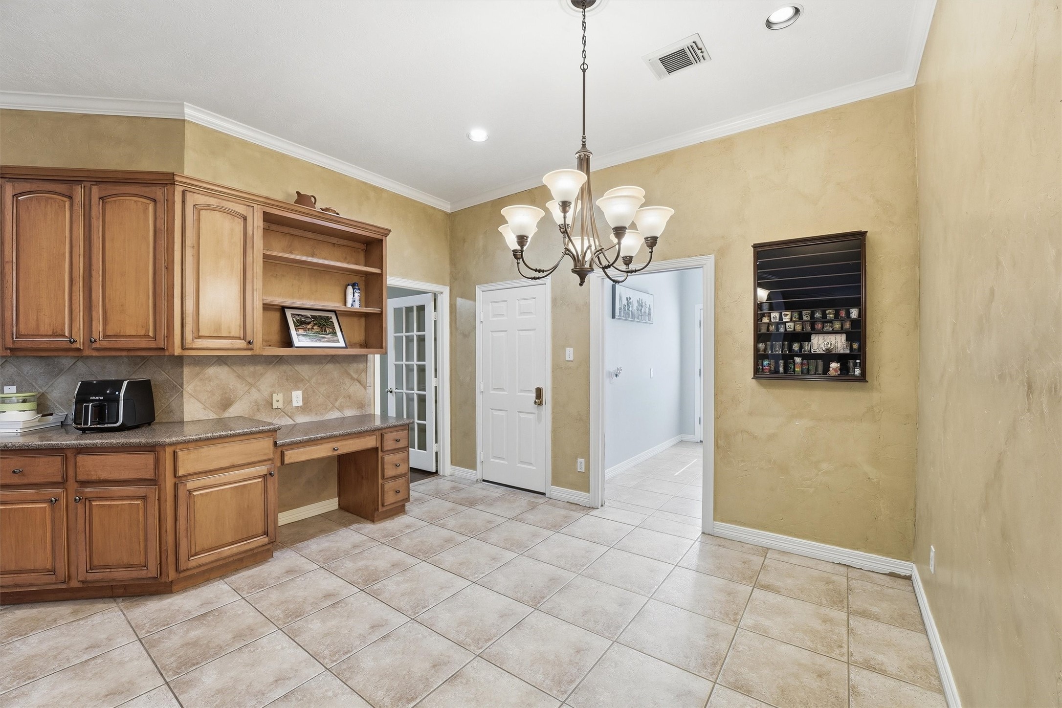 7303 Texas Laurel Loop Humble, TX 77346 - Photo 12 of 32 a view of a kitchen with stainless steel appliances granite countertop a stove a sink dishwasher and a refrigerator with wooden floor