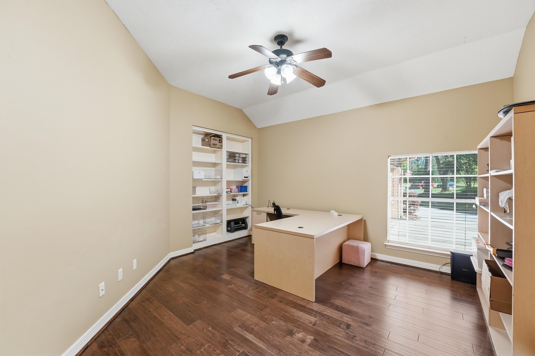 7303 Texas Laurel Loop Humble, TX 77346 - Photo 13 of 32 a living room with a white furniture window and a ceiling fan