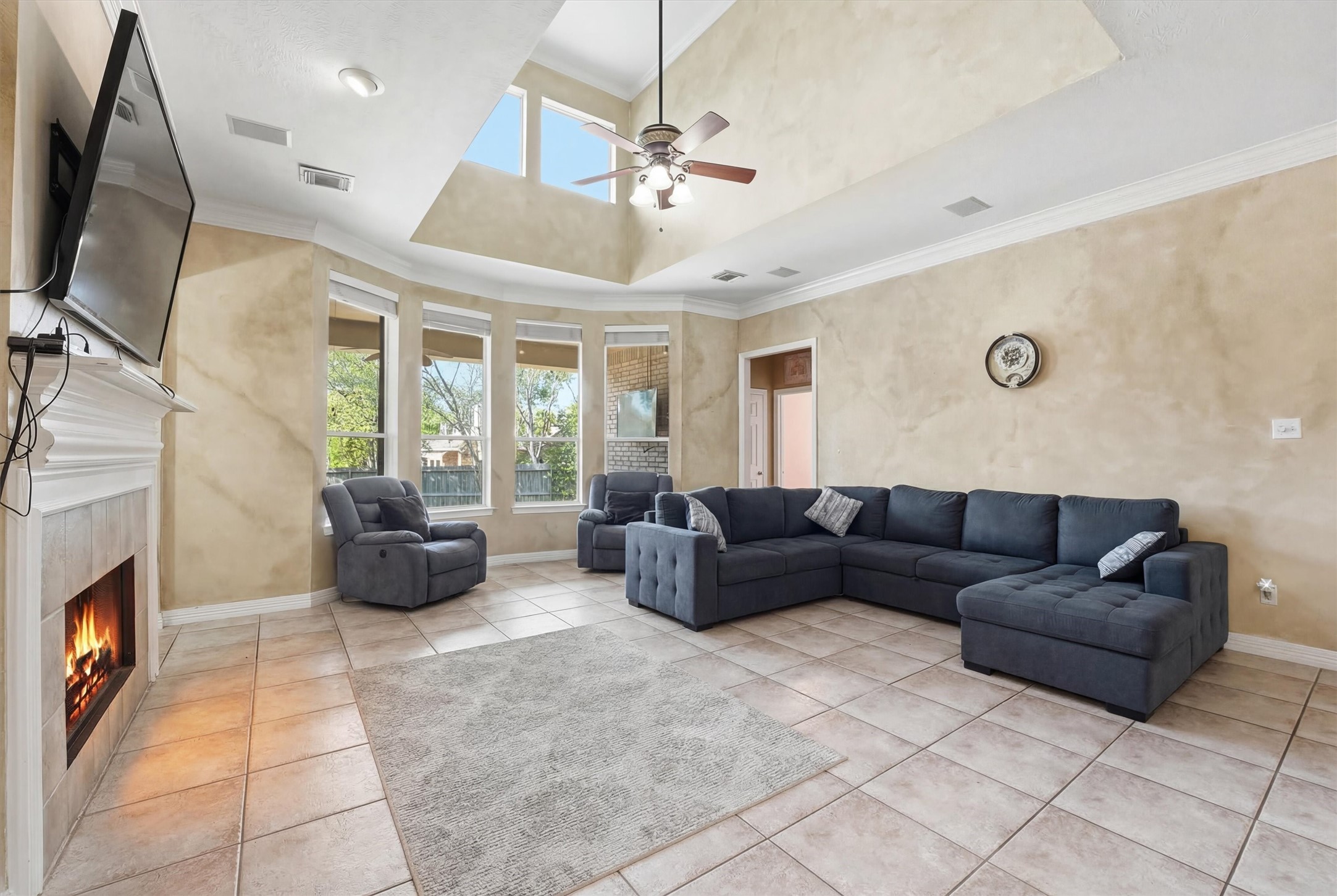 7303 Texas Laurel Loop Humble, TX 77346 - Photo 15 of 32 a living room with furniture and a fireplace