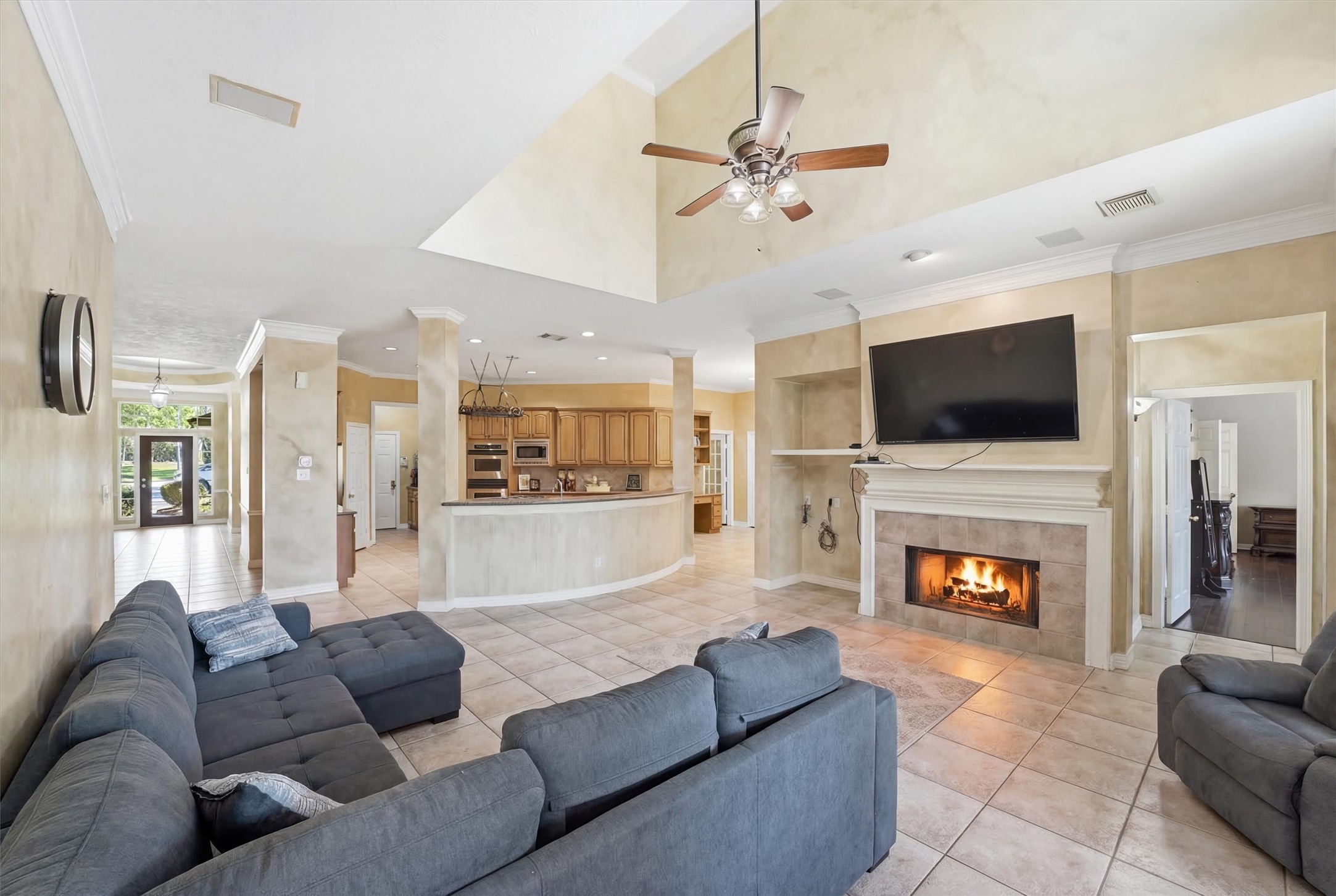 7303 Texas Laurel Loop Humble, TX 77346 - Photo 16 of 32 a living room with fireplace furniture and a flat screen tv