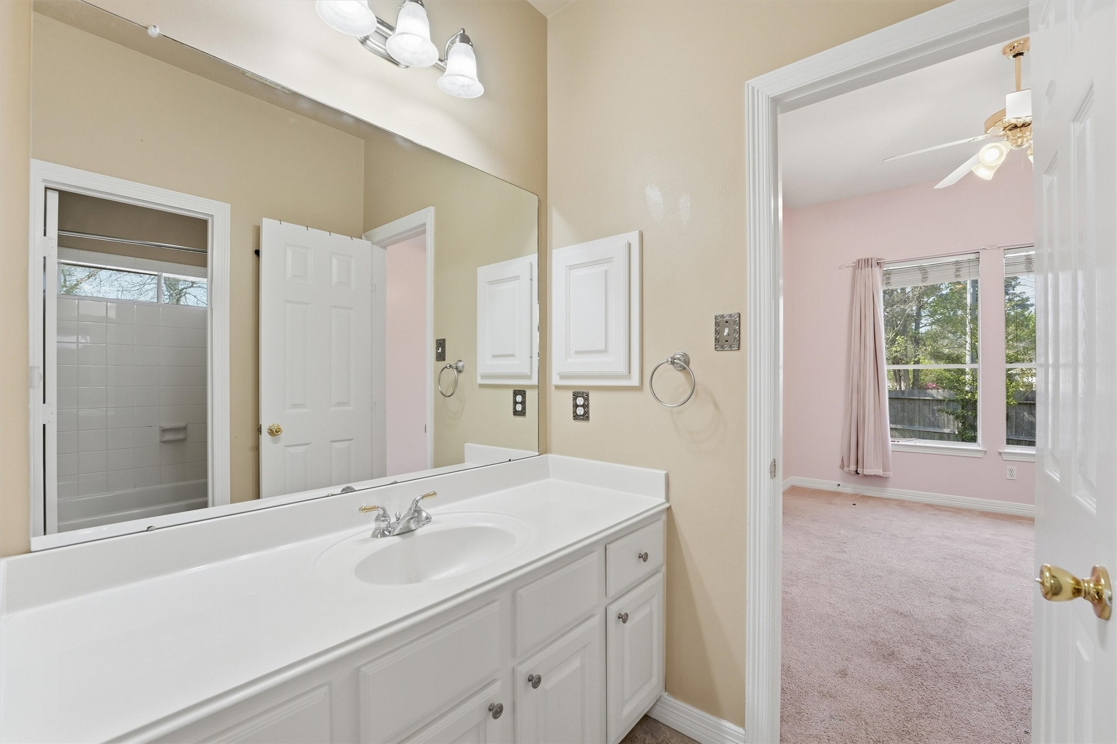 7303 Texas Laurel Loop Humble, TX 77346 - Photo 18 of 32 a bathroom with a double vanity sink mirror and double