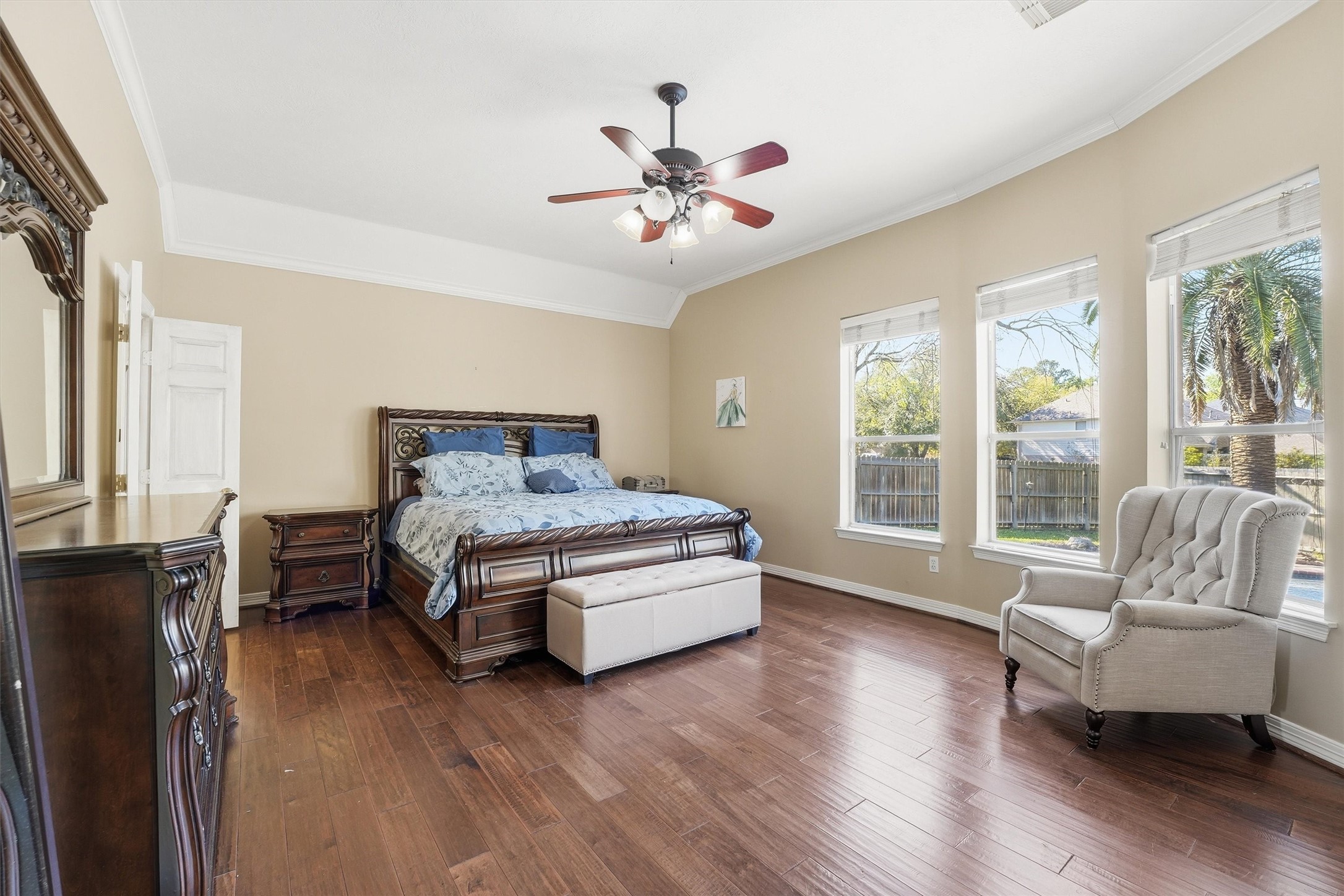 7303 Texas Laurel Loop Humble, TX 77346 - Photo 20 of 32 a bedroom with a bed and wooden floor