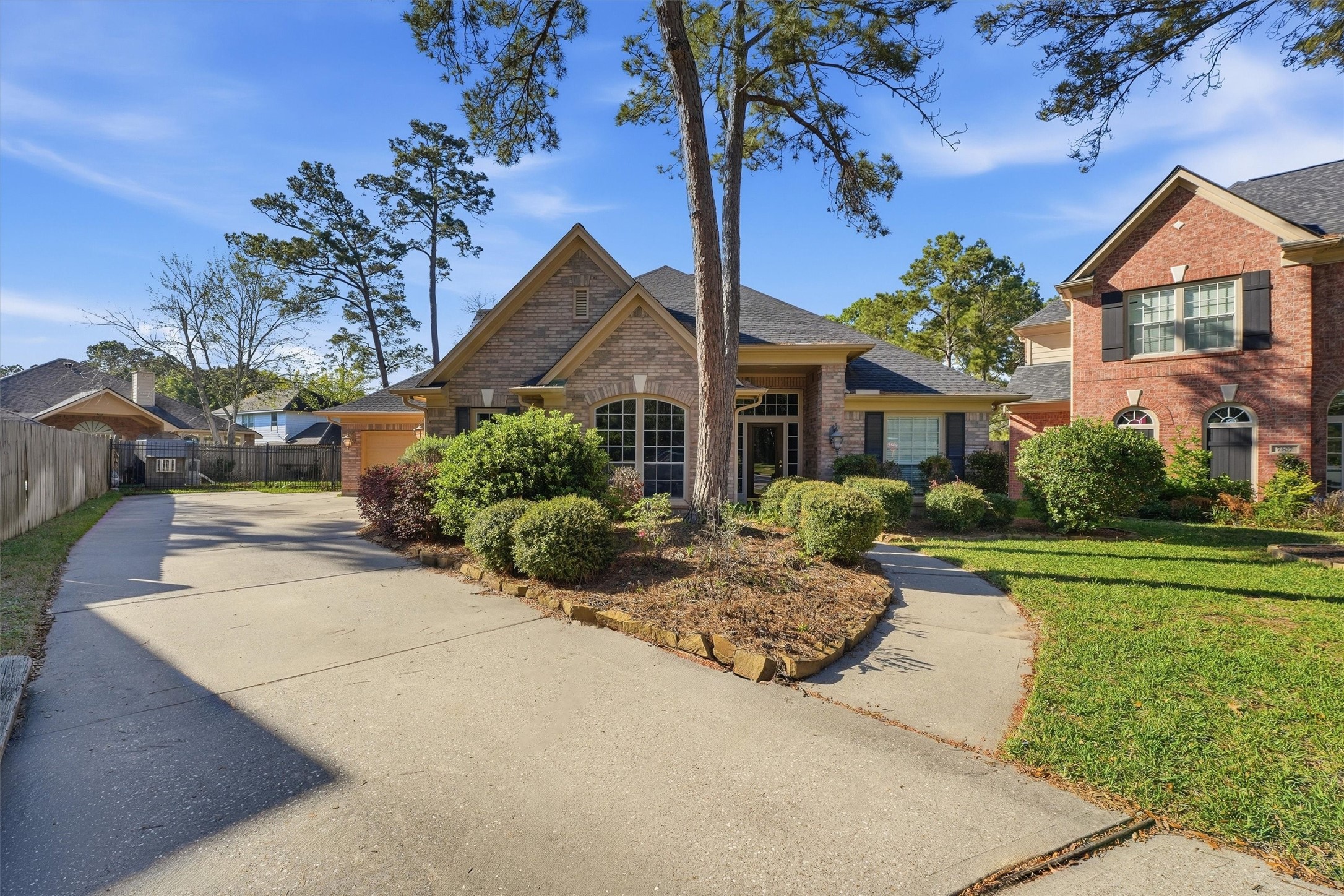 7303 Texas Laurel Loop Humble, TX 77346 - Photo 2 of 32 a front view of a house with a yard