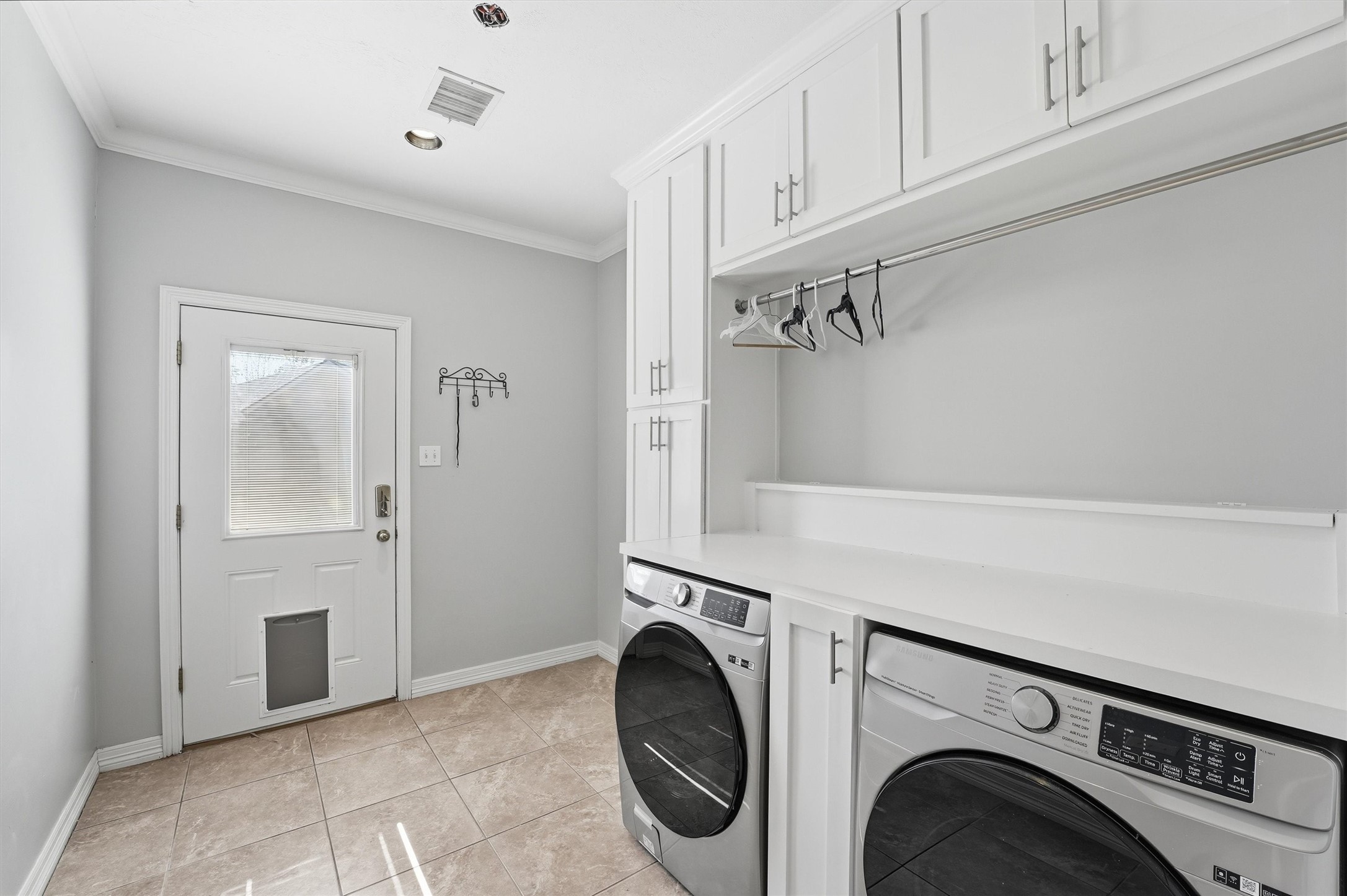 7303 Texas Laurel Loop Humble, TX 77346 - Photo 23 of 32 a view of a storage & utility room with washer and dryer