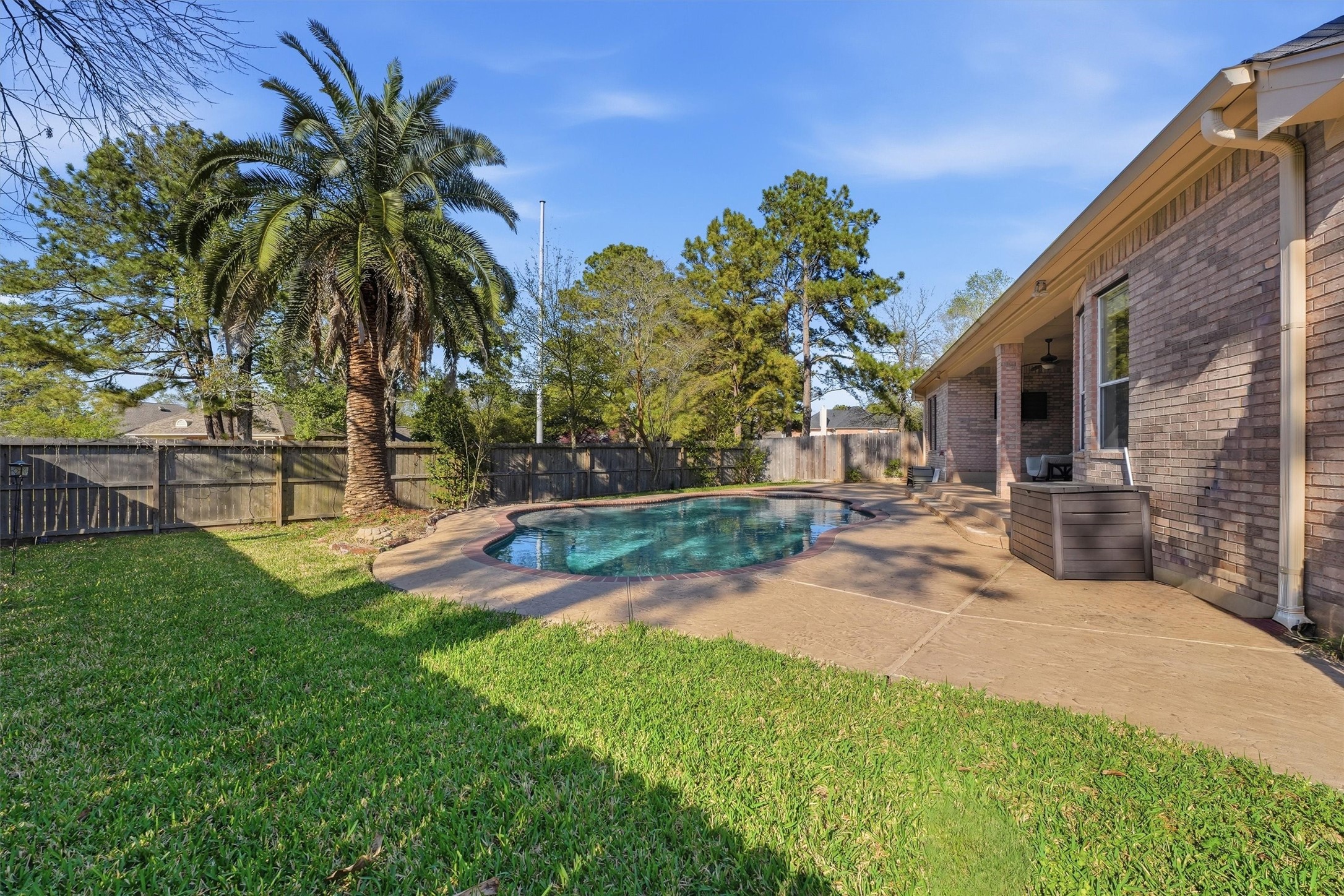 7303 Texas Laurel Loop Humble, TX 77346 - Photo 26 of 32 a view of a backyard with a patio