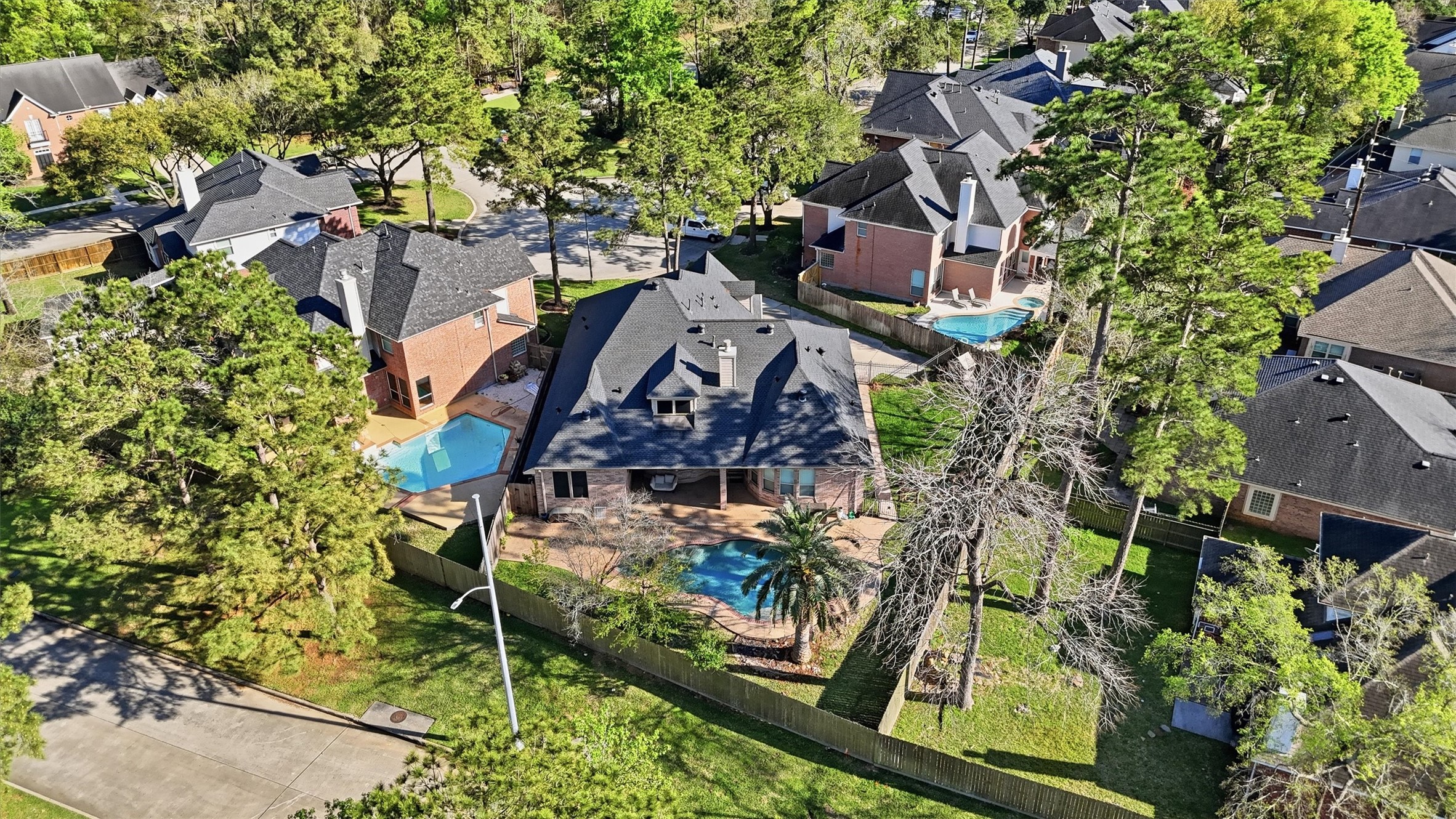 7303 Texas Laurel Loop Humble, TX 77346 - Photo 30 of 32 an aerial view of residential houses with outdoor space