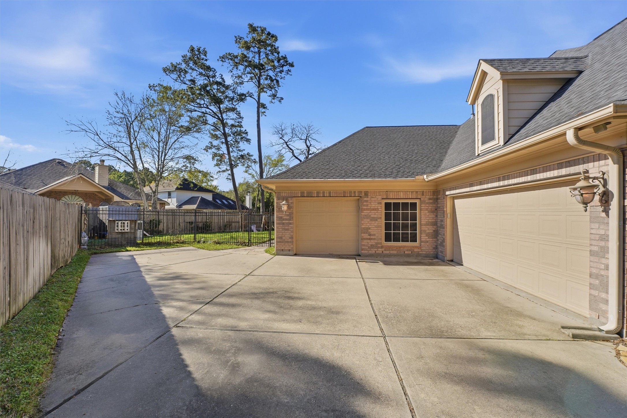 7303 Texas Laurel Loop Humble, TX 77346 - Photo 3 of 32 a view of a house with a backyard