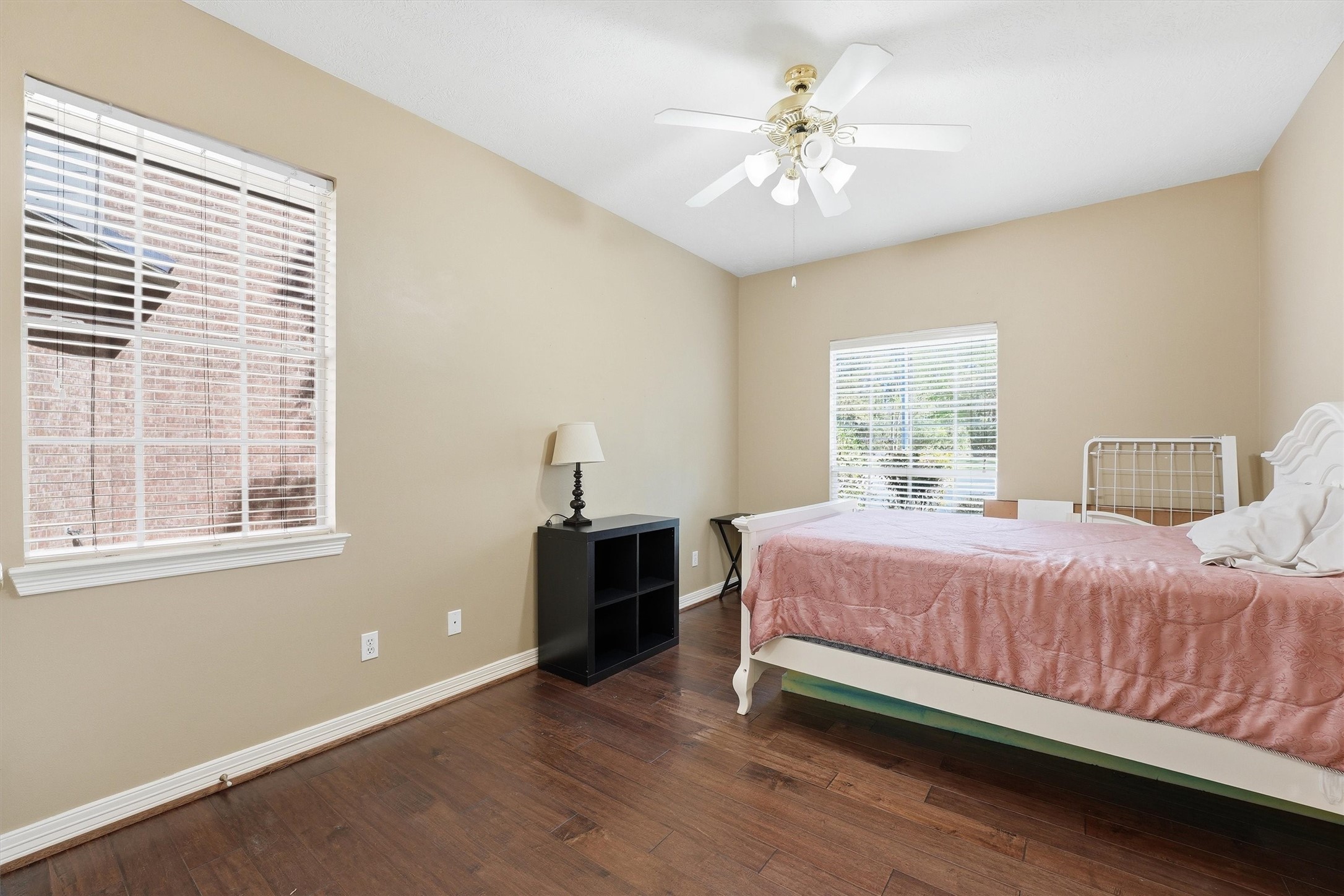 7303 Texas Laurel Loop Humble, TX 77346 - Photo 5 of 32 a bedroom with a bed and a chandelier