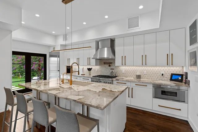 a kitchen with a stove a sink and a refrigerator