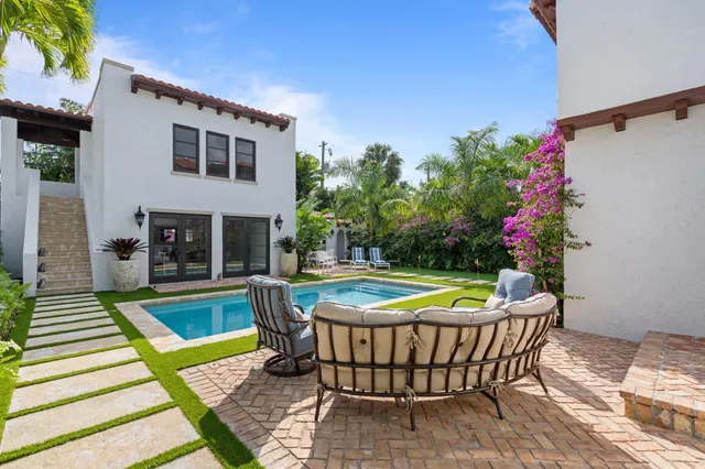a view of a chairs and table in the patio